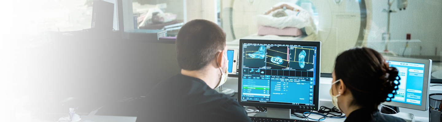 Clinicians reviewing computer image