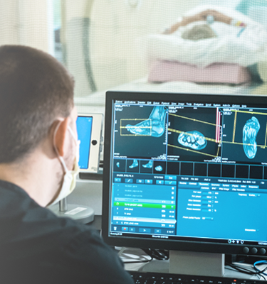 Clinicians reviewing computer image