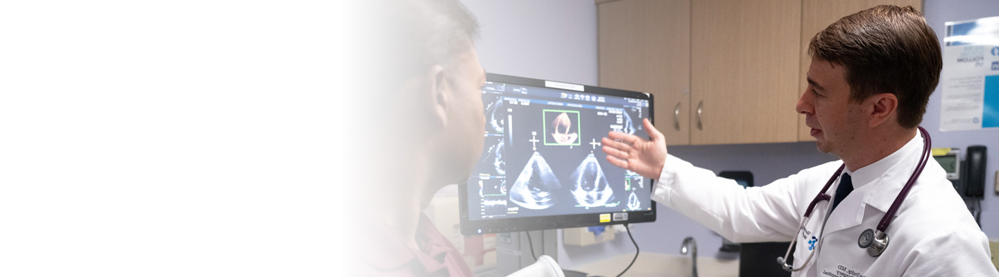 Doctor reviewing medical imaging with patient