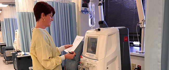 provider using a dialysis machine