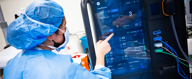 Surgeon Pointing at Screen