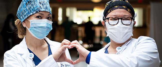 Nurses making a heart with their fingers