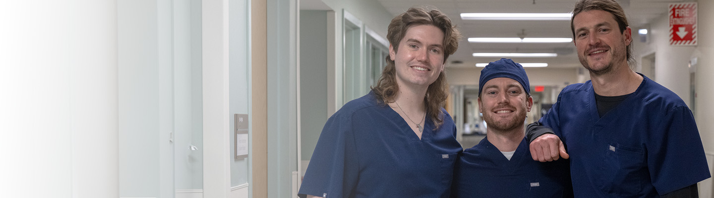 Three male healthcare professionals