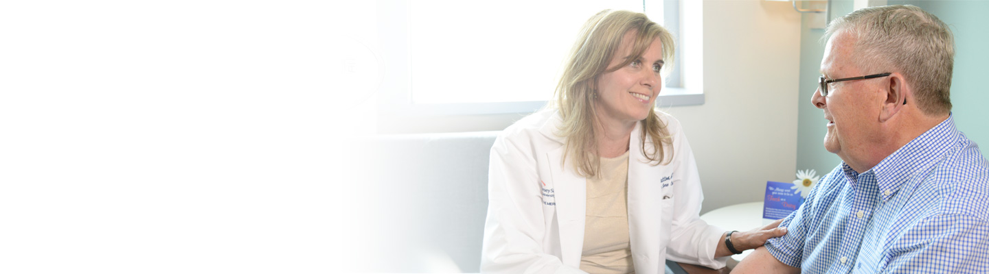 Doctor meeting with patient during consultation