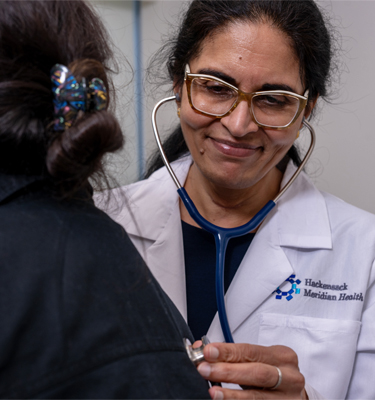 Primary care physician is examining the patient in the exam room