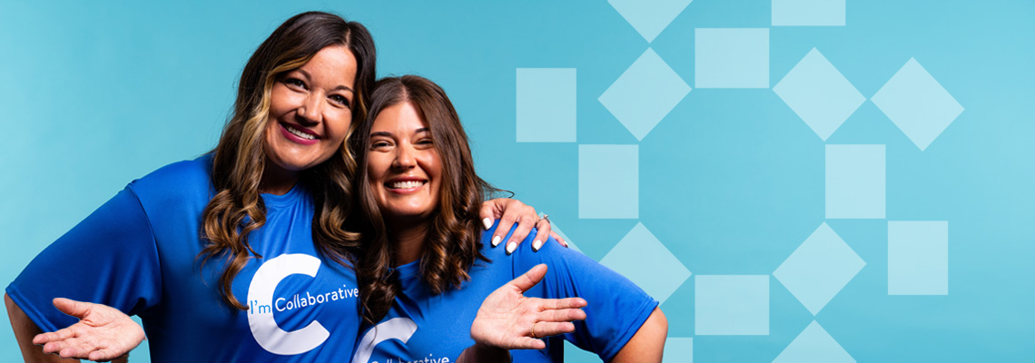women smiling wearing collaborative shirts