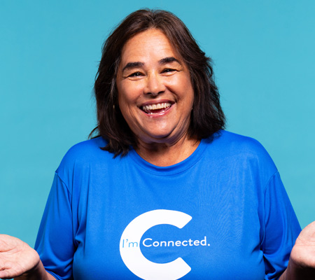 Woman smiling wearing connected shirt