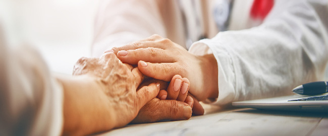 Two people holding hands close-up on hands