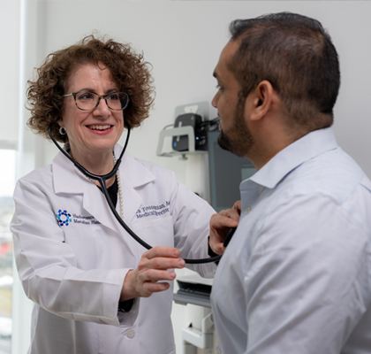 Physician listening to a patient's heartbeat