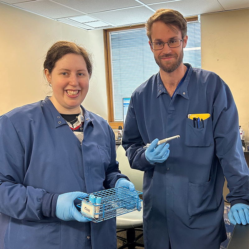 Two students standing together at Florence M. Cook School of Medical Laboratory Science.