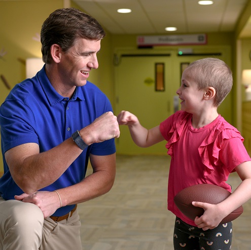 child and provider fist bumping