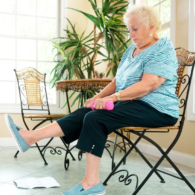 senior woman working out at home