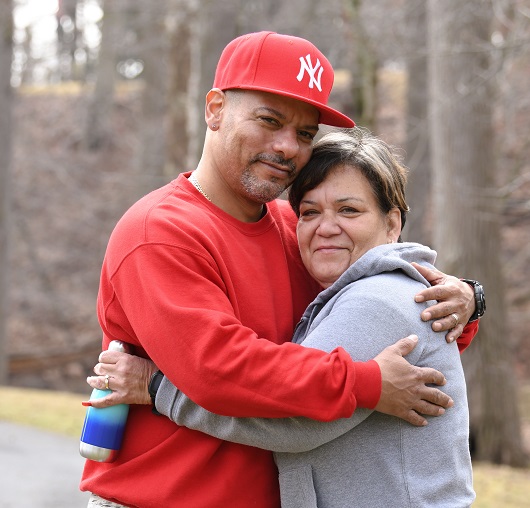 Couple embracing outside
