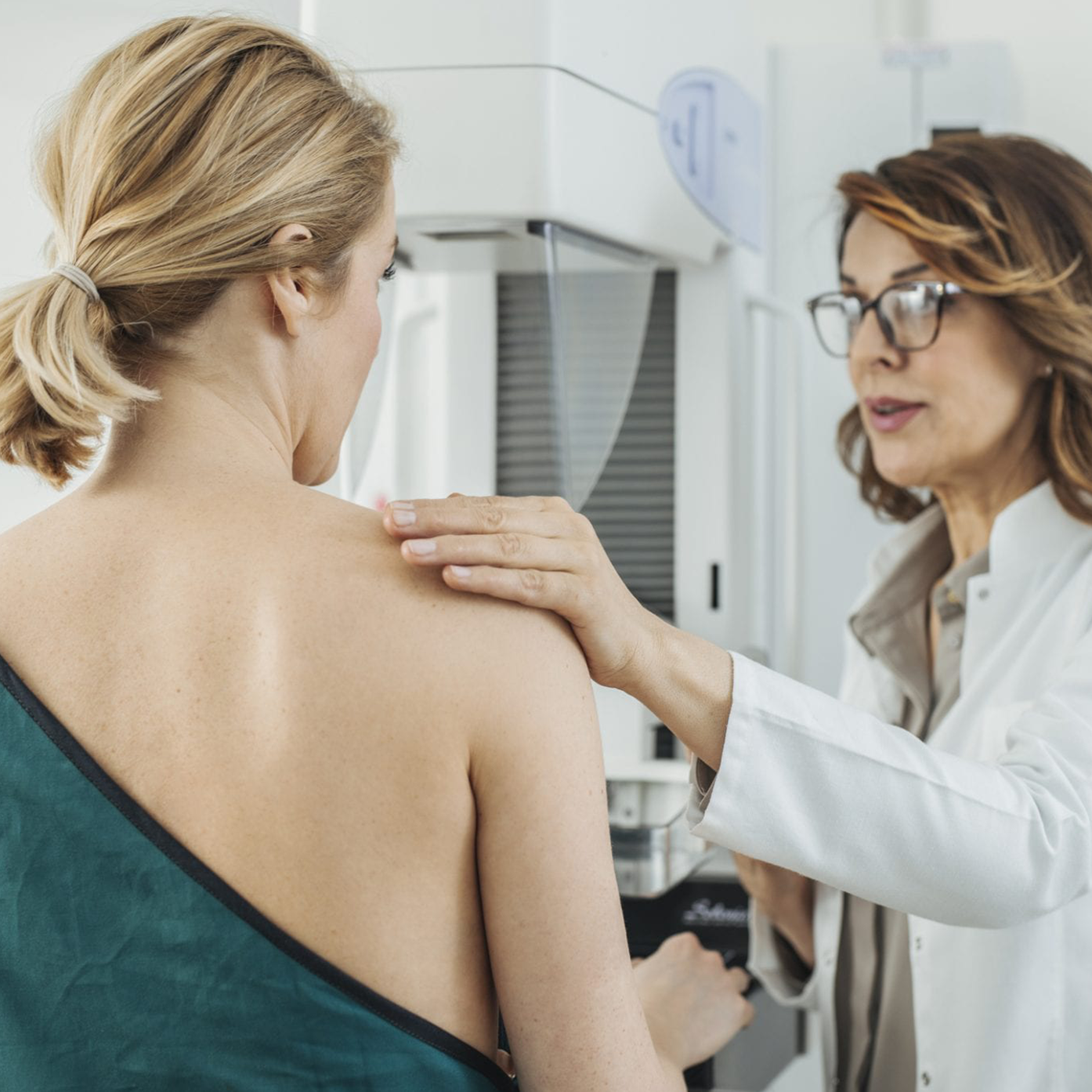 Woman In 40s Getting Mammogram with Doctor