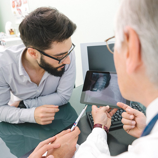 Doctor and patient looking at Lung Cancer Screening