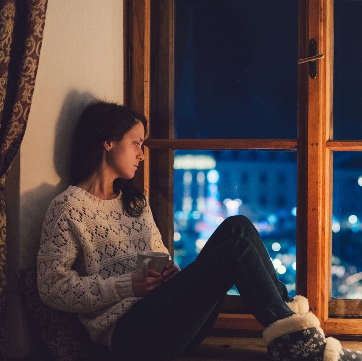 woman looking out the window