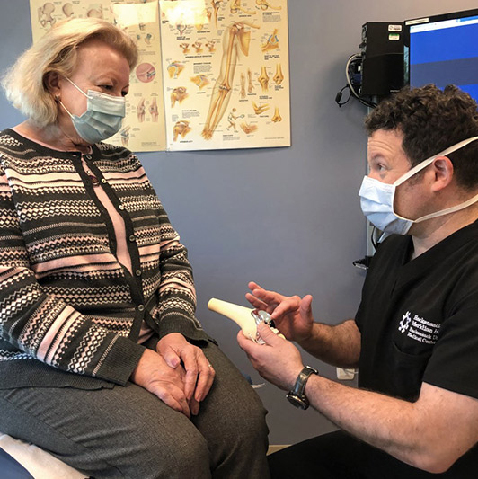 Woman discussing her care with her provider.