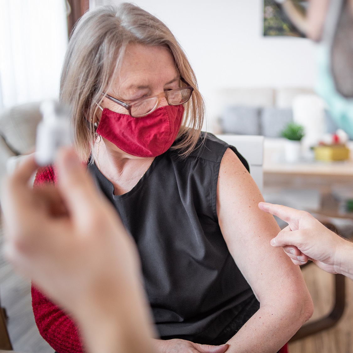 Older woman talking with doctor