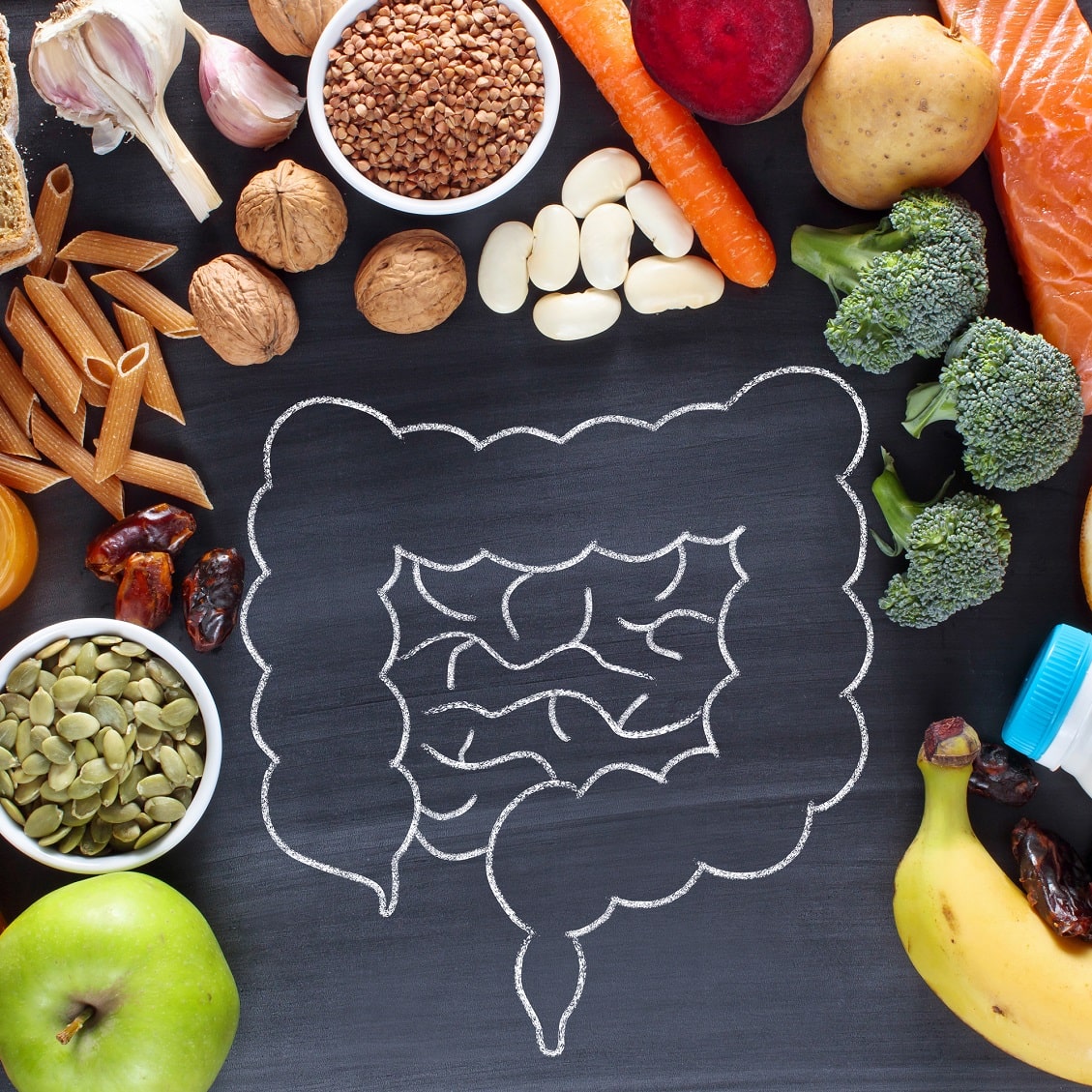 chalk drawing of intestines with food around it