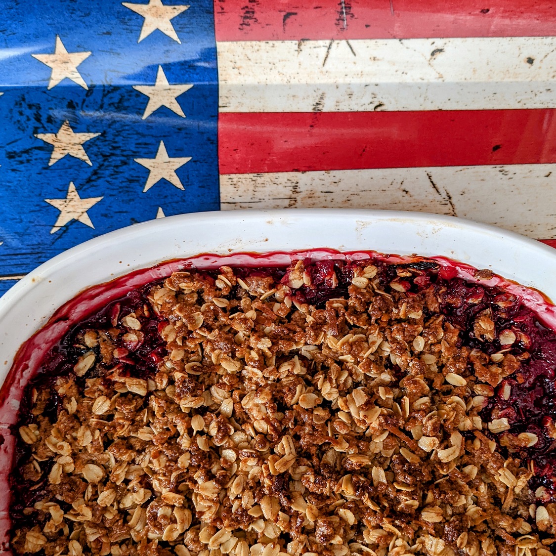 Fruit crisp dish in front of an American flag
