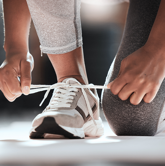 person tying a sneaker