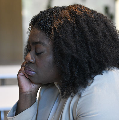 Young woman tired, experiencing brain fog due to long COVID.