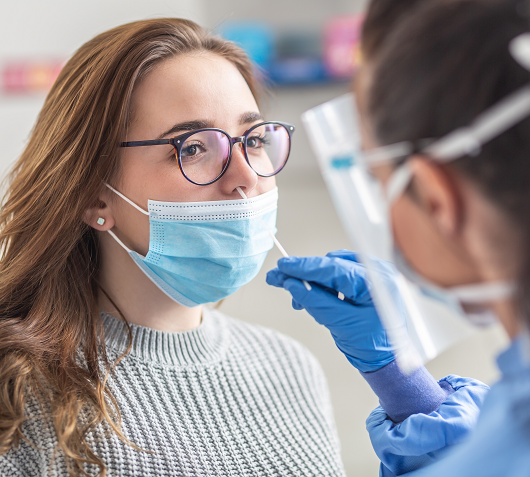 young woman gets a COVID test