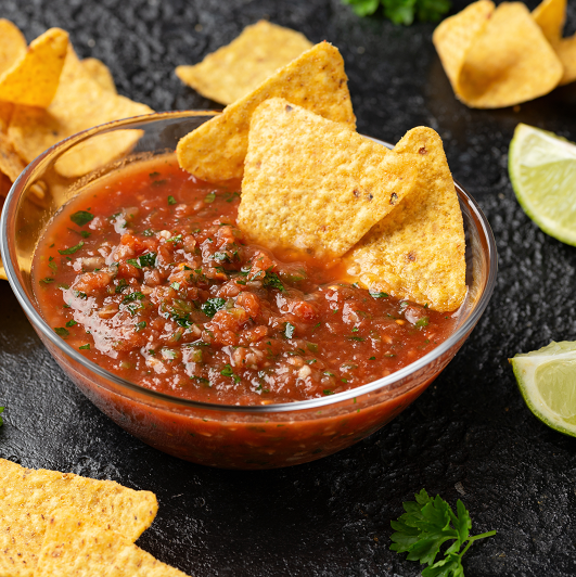 close up shot of chips and homemade salsa