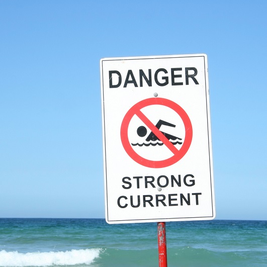 Warning Sign "Danger Strong Current" at the beach.