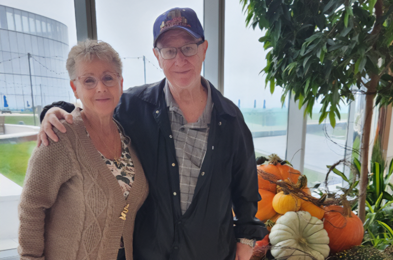 71-year-old Old Bridge Medical Center security officer Richard Bruno stands with his arm around his wife.