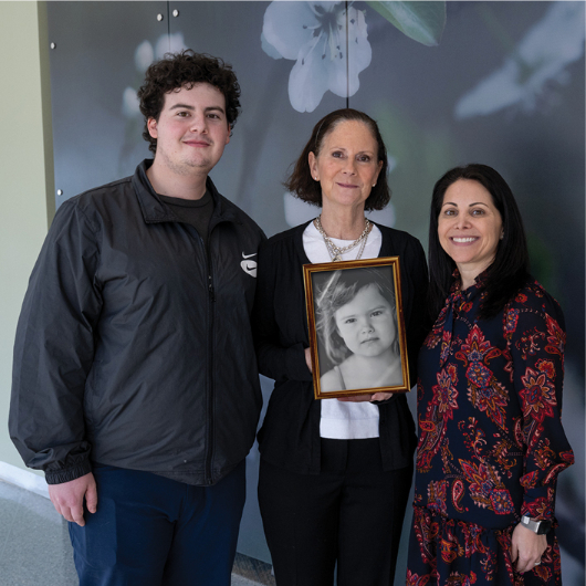 Kelly Lin Terry holds a framed photo of her daughter, Mya Lin.