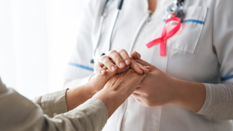 Doctor holding hands with patients