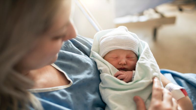 A mother with her newborn baby at the hospital.