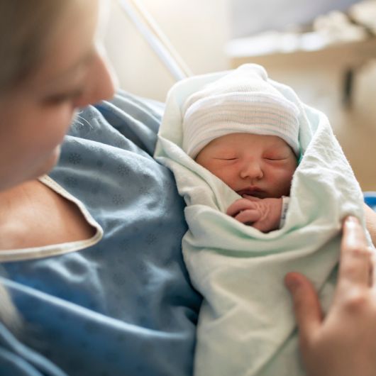 A mother with her newborn baby at the hospital.