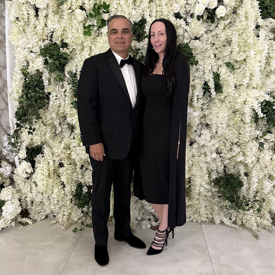 2 people standing in black dress