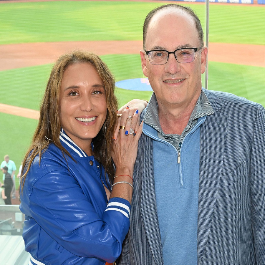 Steven and Alex Cohen, founders of the Steven & Alexandra Cohen Foundation, standing together in front of a baseball field