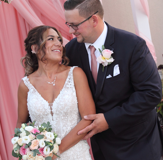 Adrienne A with her husband on their wedding day