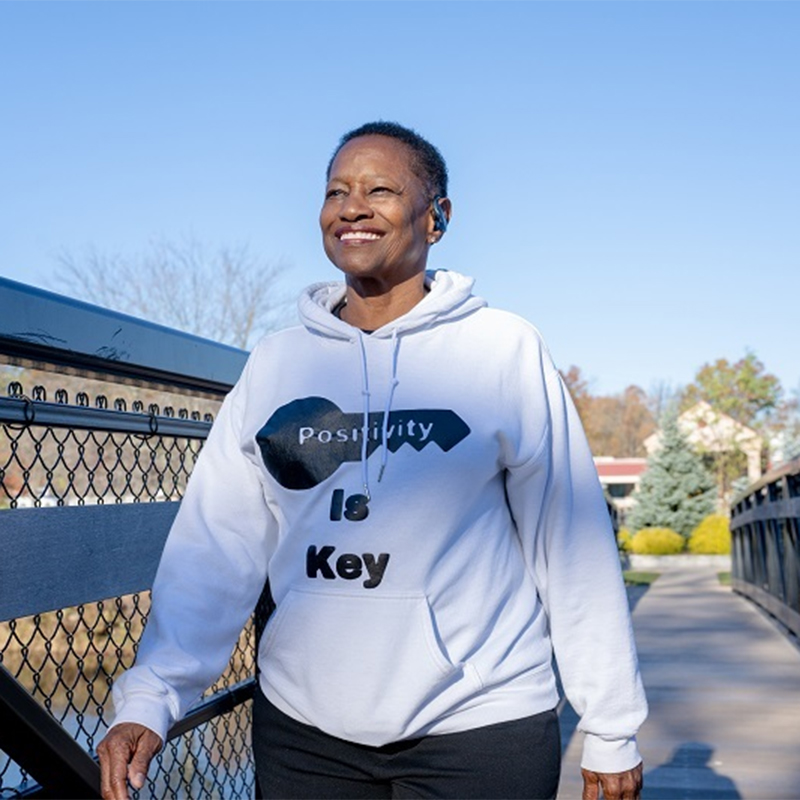 Evon Terrell smiling outside taking a walk.