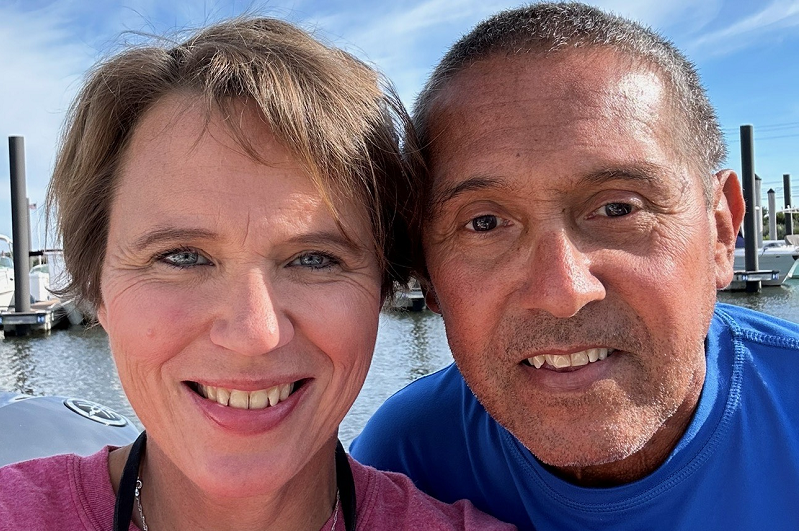 Emily Kmosko and her fiance smiling.