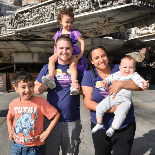 Imani Waldman holds her infant son next to her husband, daughter and older son.