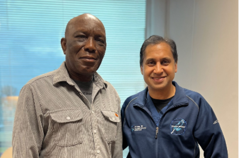 Dr. Daniel Seddoh, a retired corporate executive and professor from Ghana, stands next to Ravi Munver, M.D.