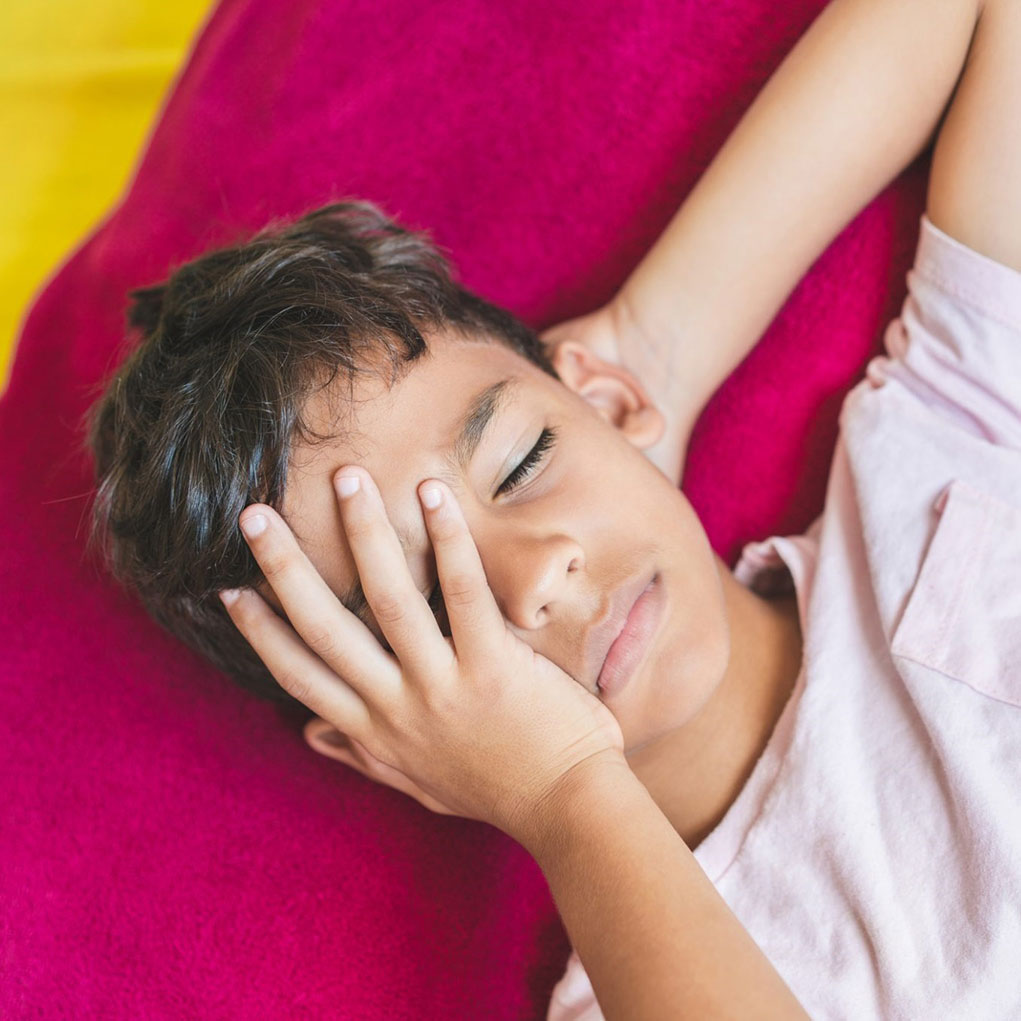 Kid with hand on forehead