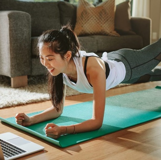 young woman doing a plank
