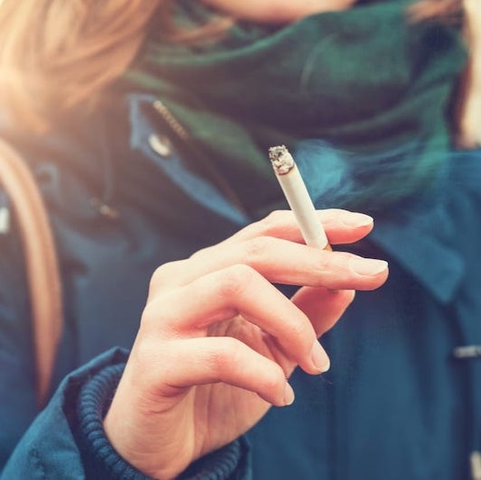 person smoking a cigarette