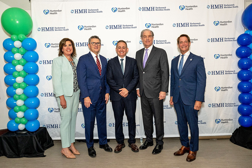 HMH and Hunterdon Health leaders posing at letter of intent signing