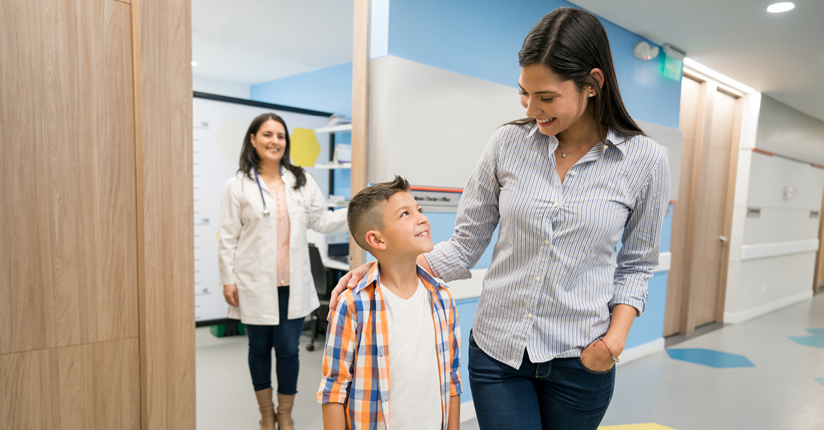 Parent and child leaving doctors office