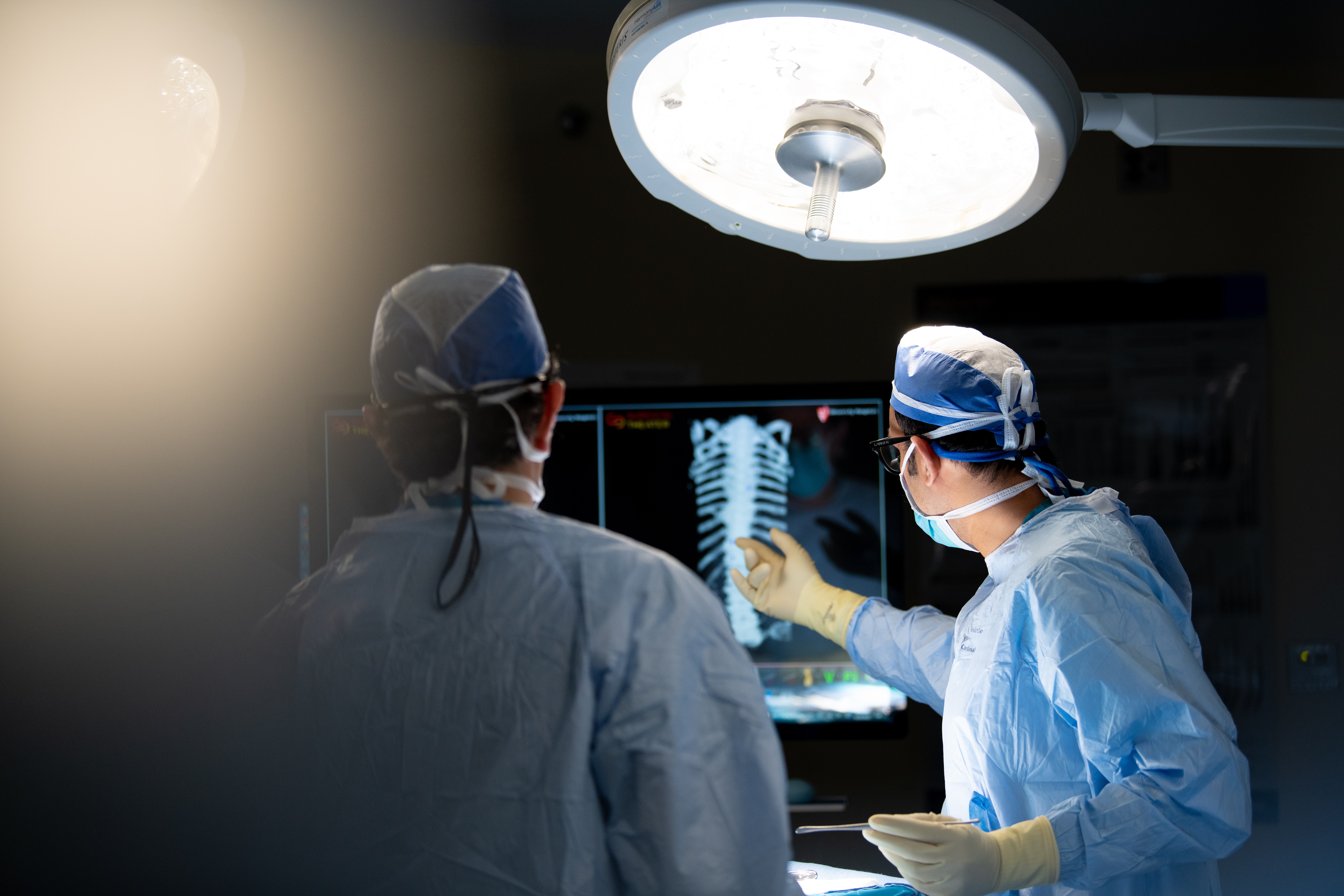 Surgeons operating on spine