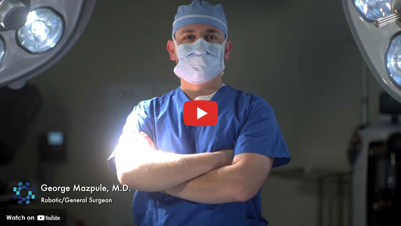 Surgeon in operating room wearing surgical mask and scrubs