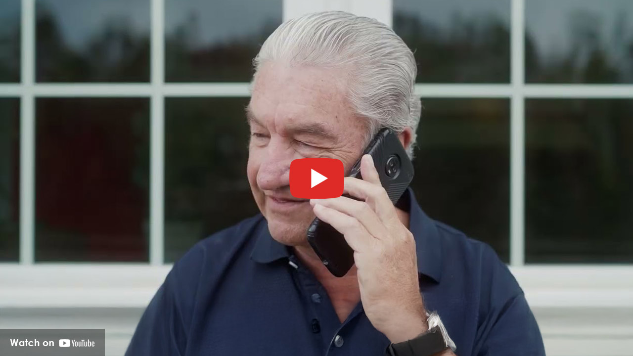 Elderly man with phone to his ear