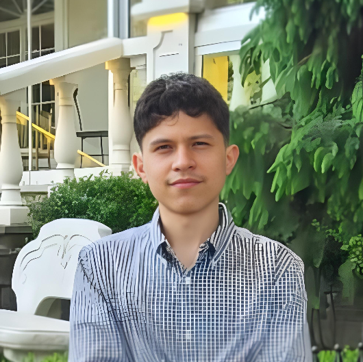 Teenage patient, Steven, smiling outside.